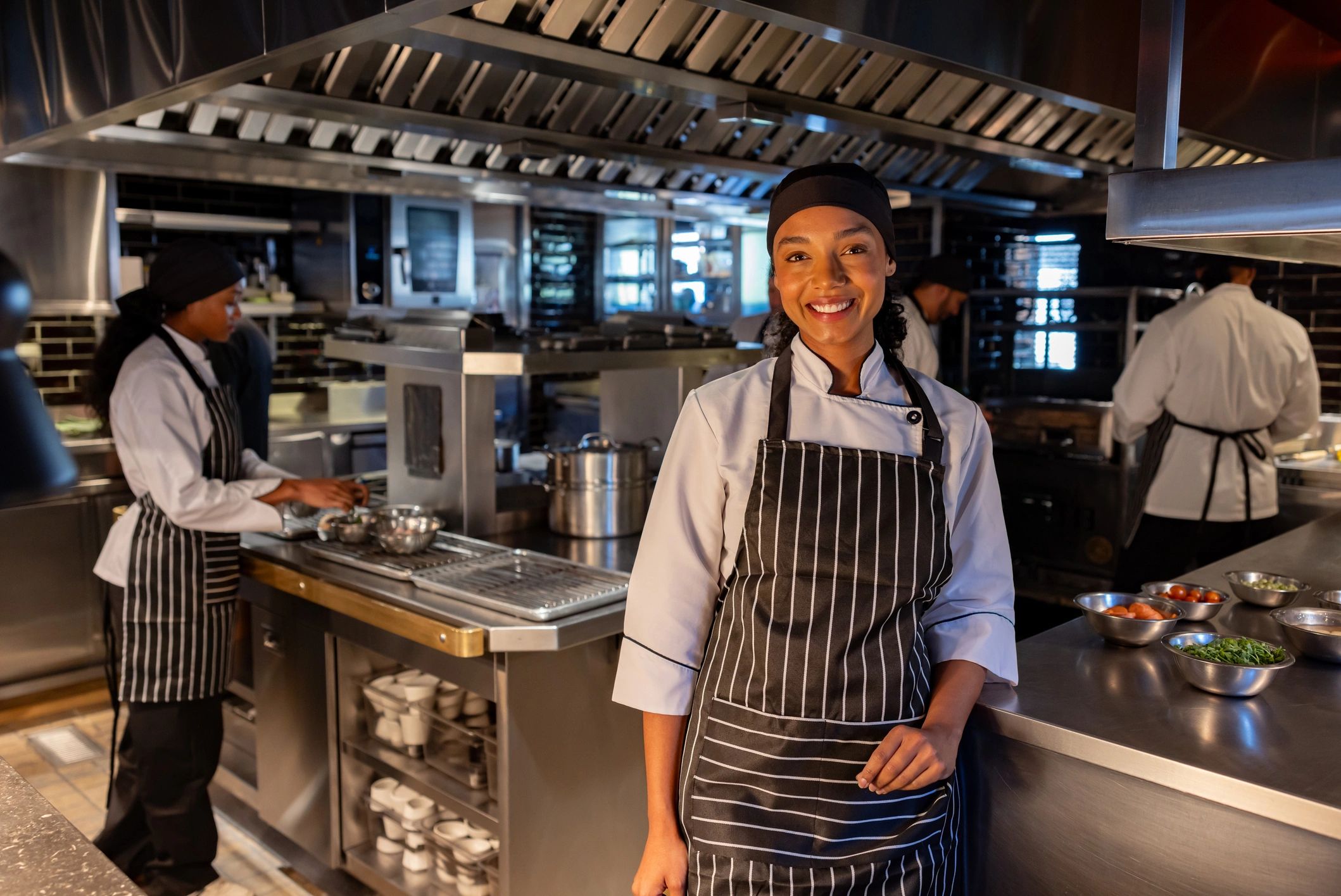 Restaurant professional smiling in a commercial kitchen