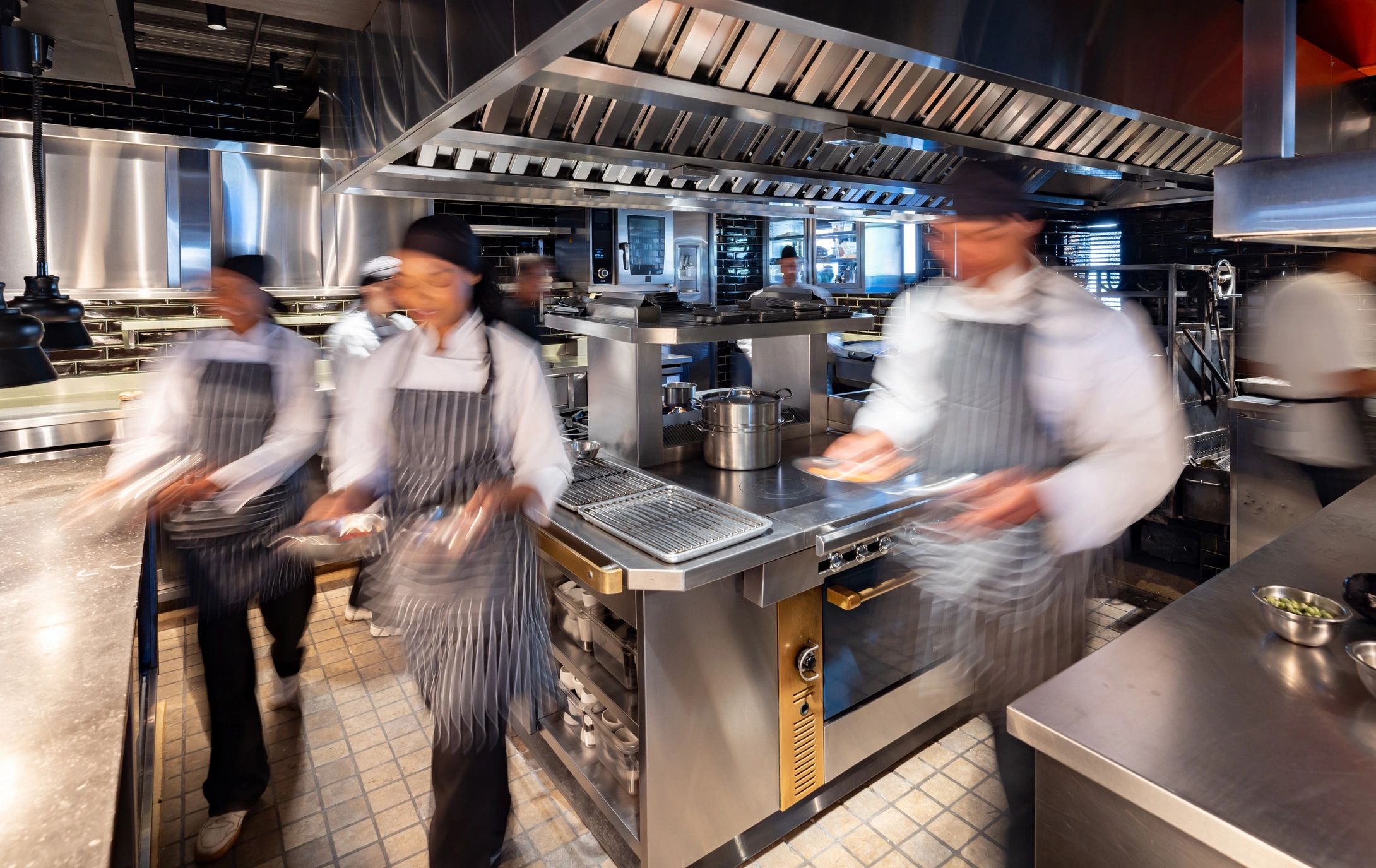 Busy commercial kitchen environment representing restaurant operations