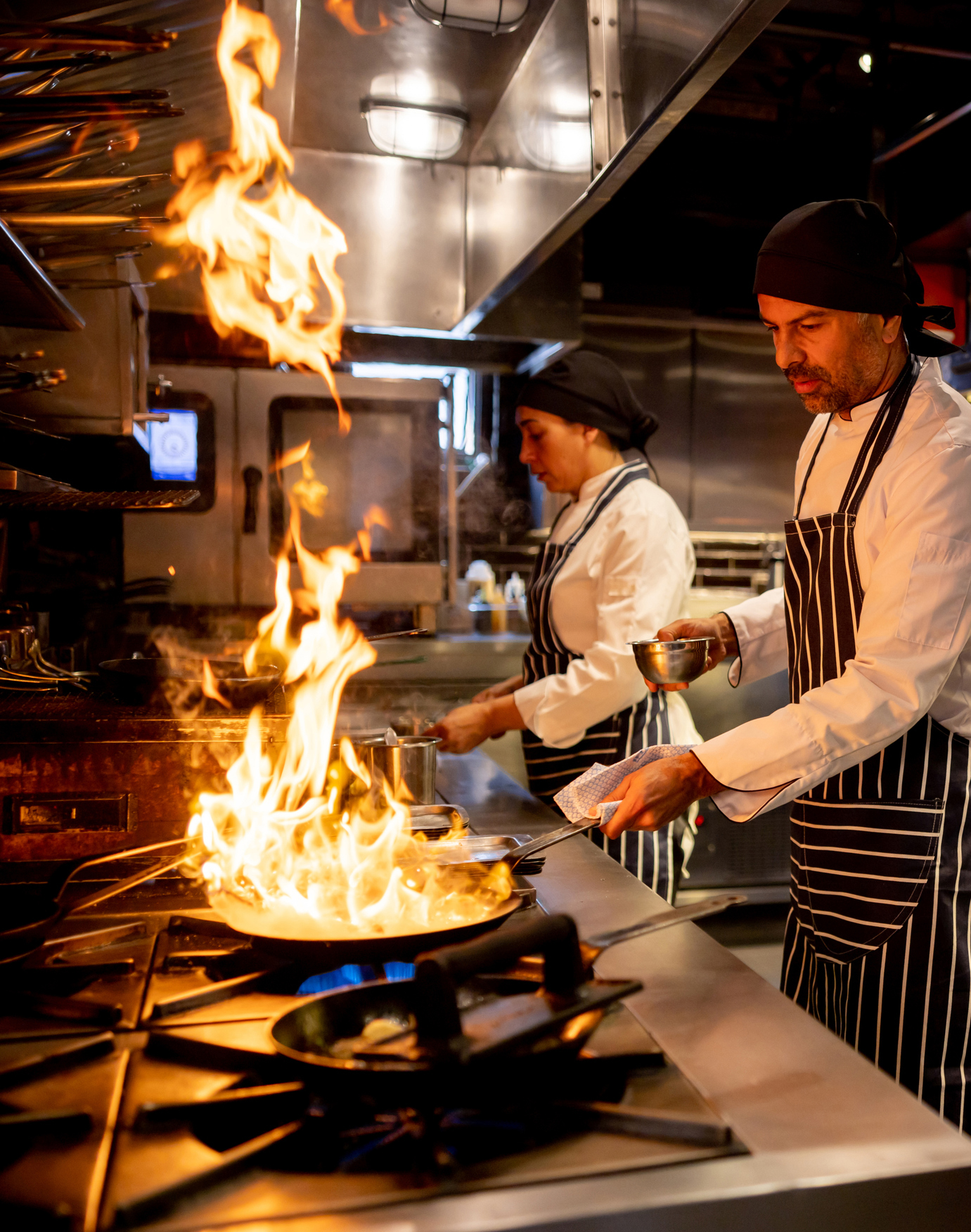 Commercial kitchen hood cleaning in a professional restaurant kitchen